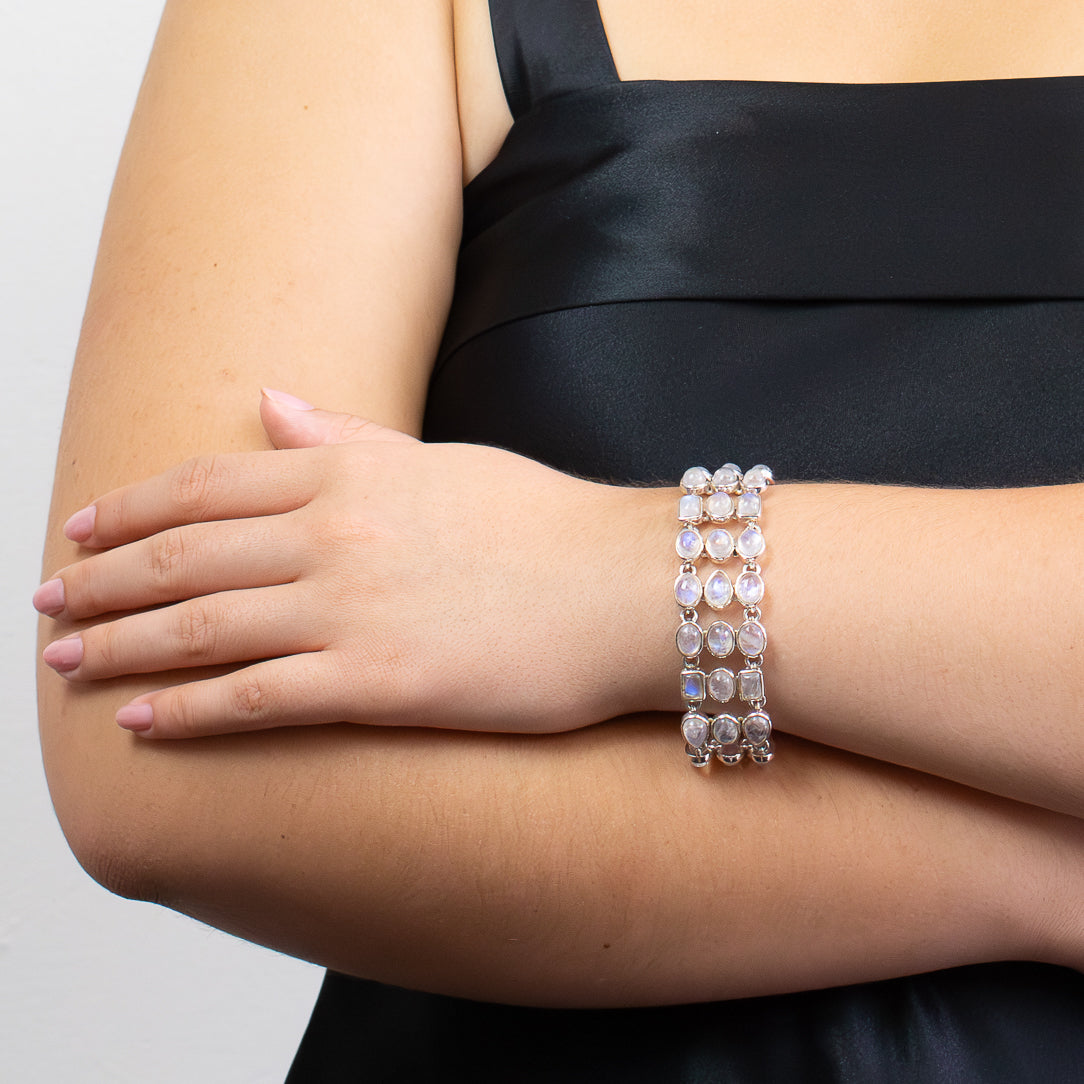 Rainbow Moonstone statement bracelet in sterling silver with mixed cabochon gemstone shapes.