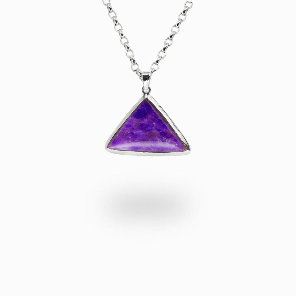 Triangle-shaped Sugilite gemstone pendant set in sterling silver with matching silver chain.