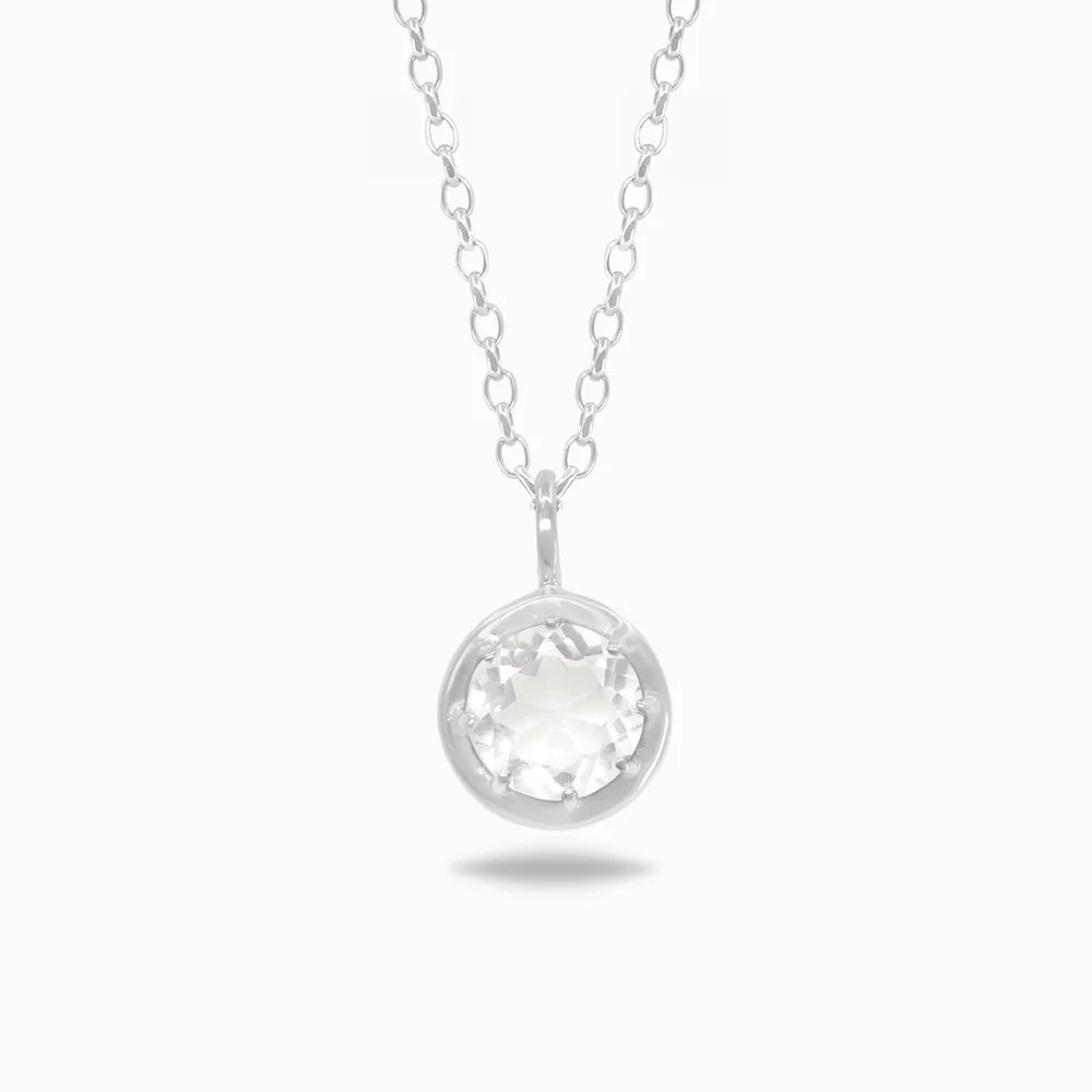 Round faceted transparent Clear Quartz gemstone set in polished sterling silver pendant necklace.