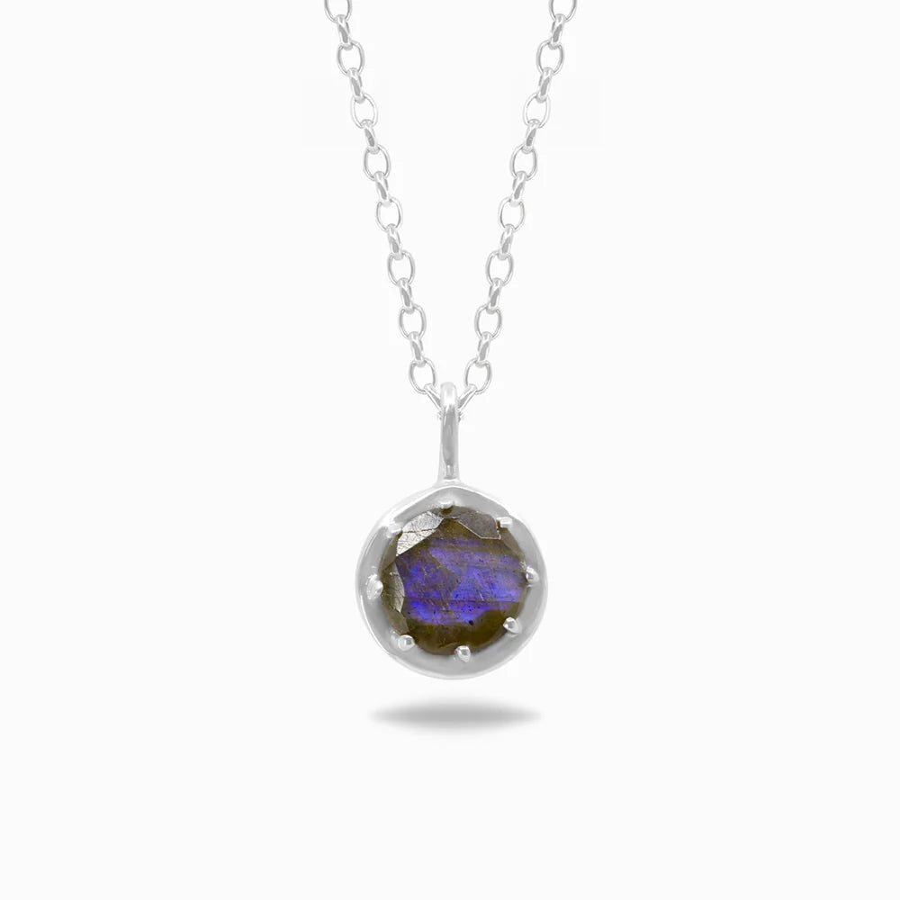 Round faceted Labradorite gemstone with blue-violet flash set in polished sterling silver pendant necklace.