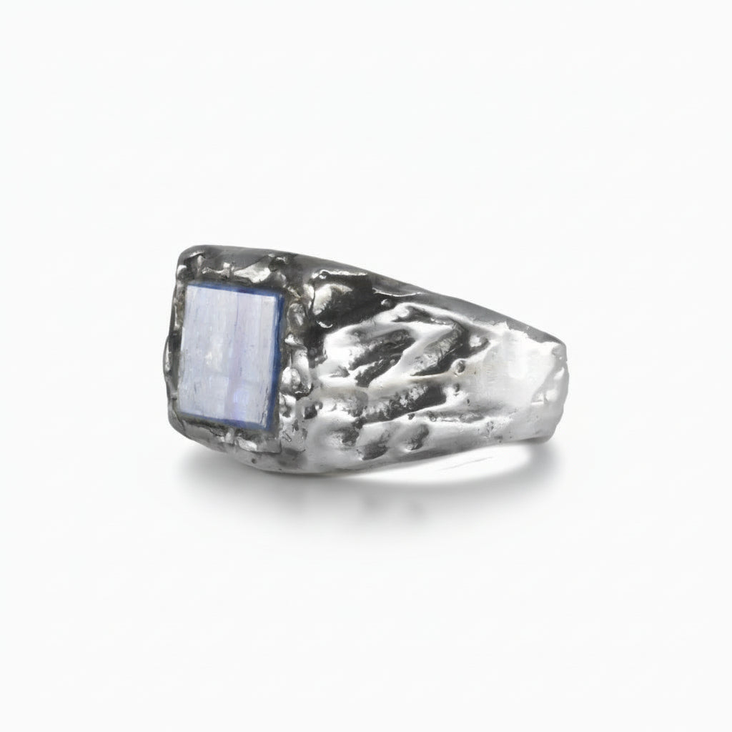 Rectangular Kyanite cabochon ring in textured sterling silver band with deep blue gemstone. | MADE IN EARTH