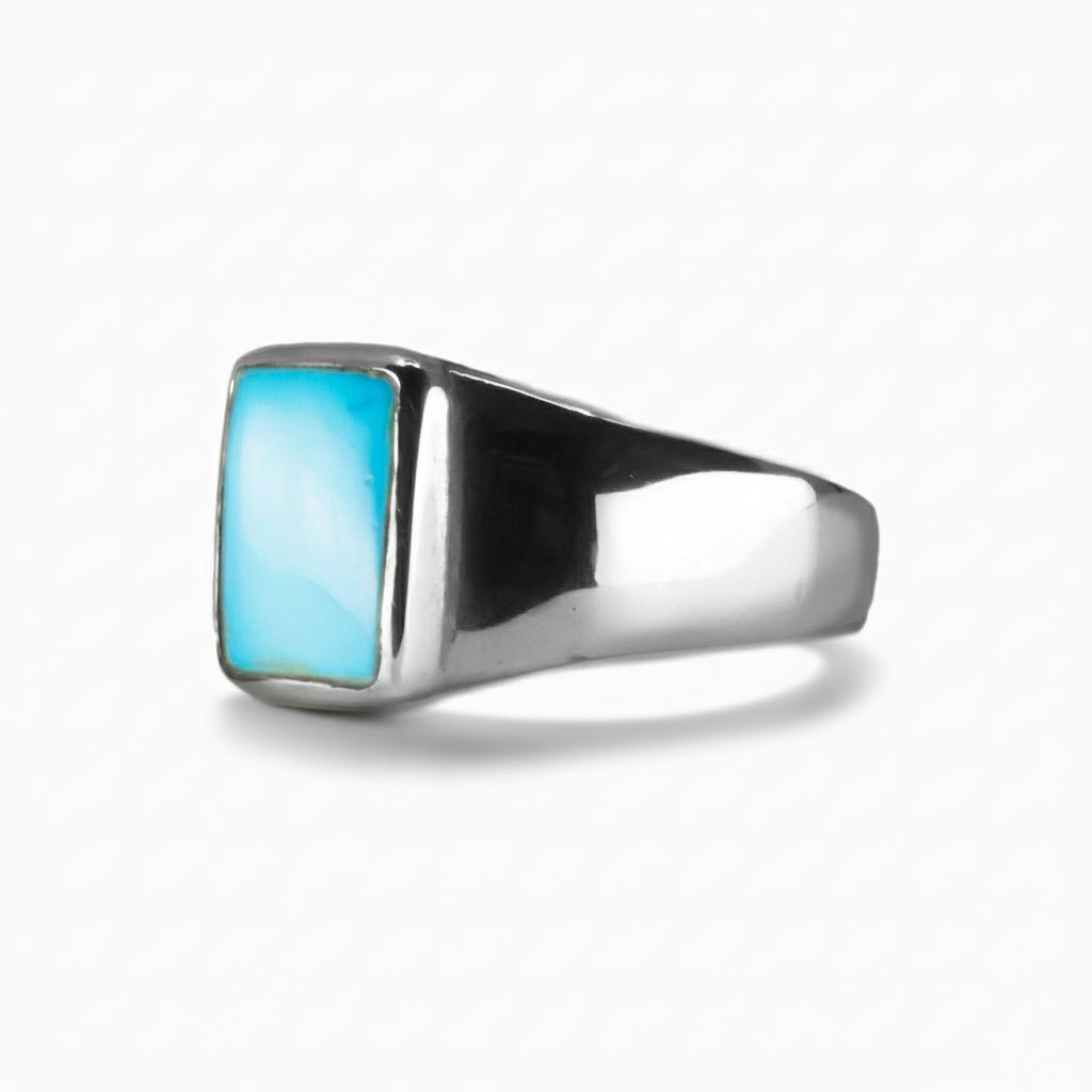 Sleeping Beauty Turquoise rectangular cabochon ring in sterling silver with vibrant sky-blue gemstone. MADE IN EARTH