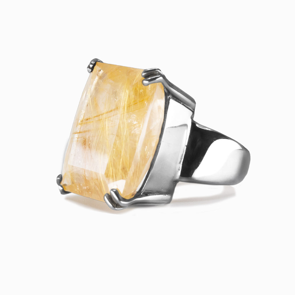 Rectangular faceted golden rutilated quartz ring set in sterling silver with golden rutile threads. MADE IN EARTH