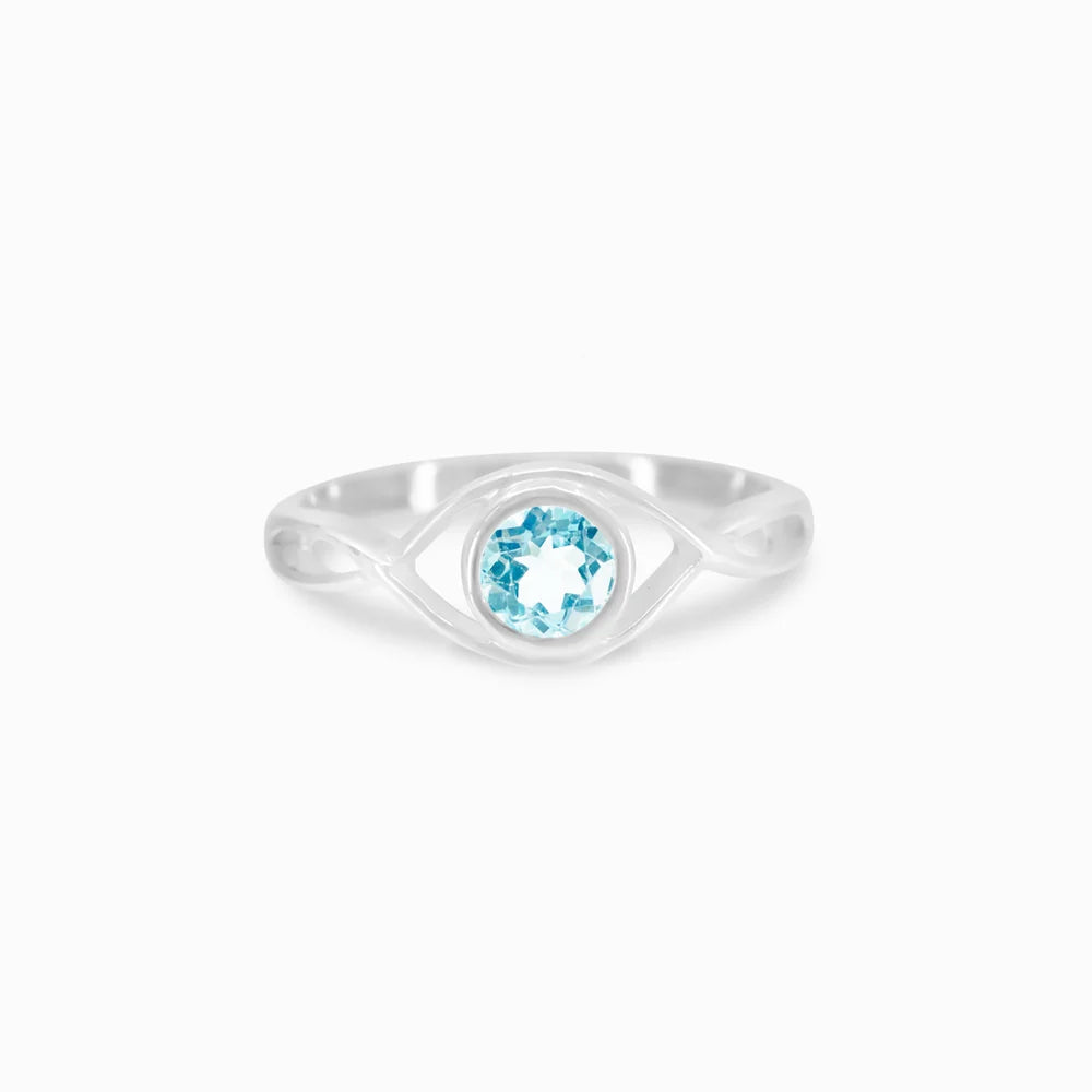 Round faceted Blue Topaz gemstone in polished sterling silver eye design ring.