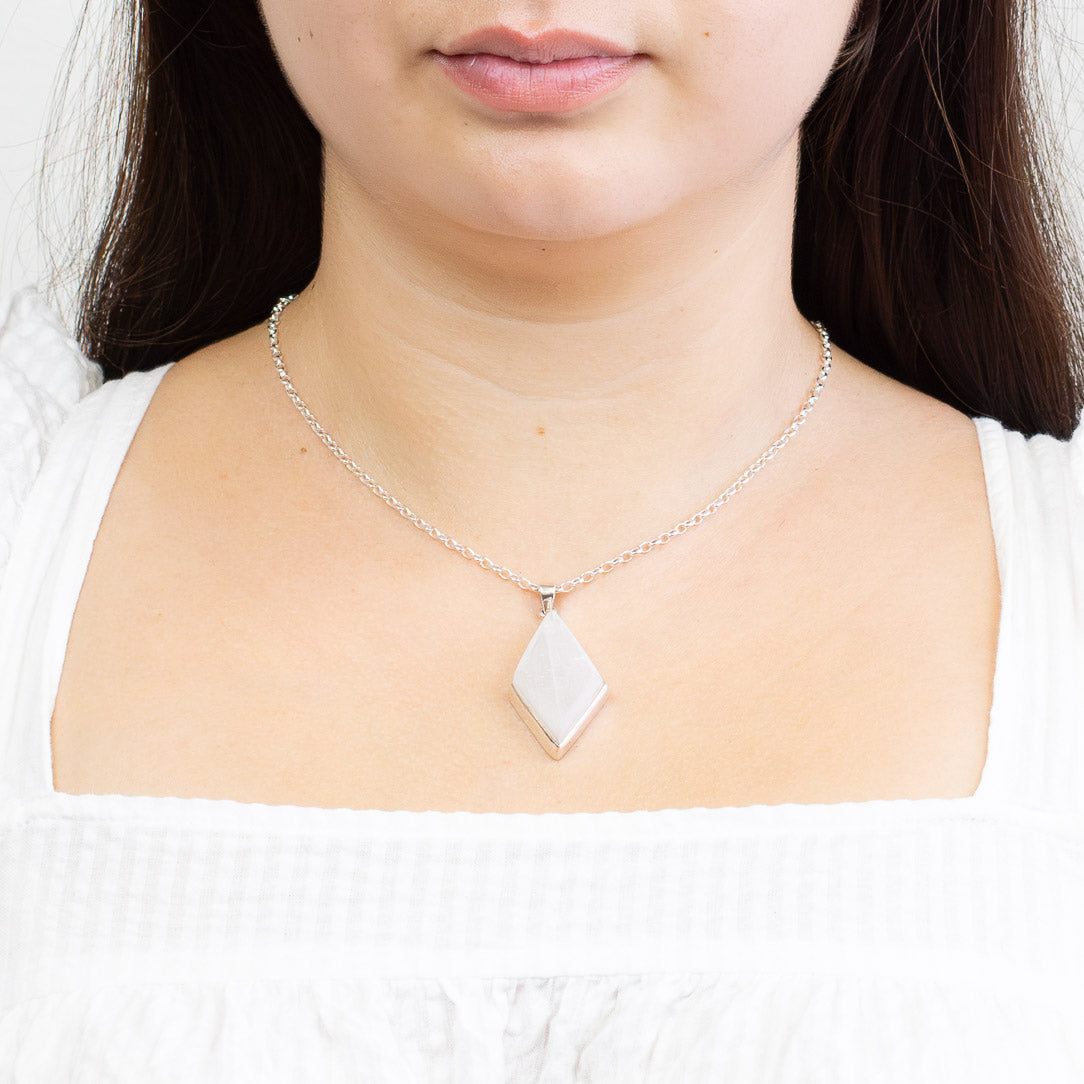 Diamond-shaped Selenite pendant in sterling silver with translucent white gemstone. | MADE IN EARTH 