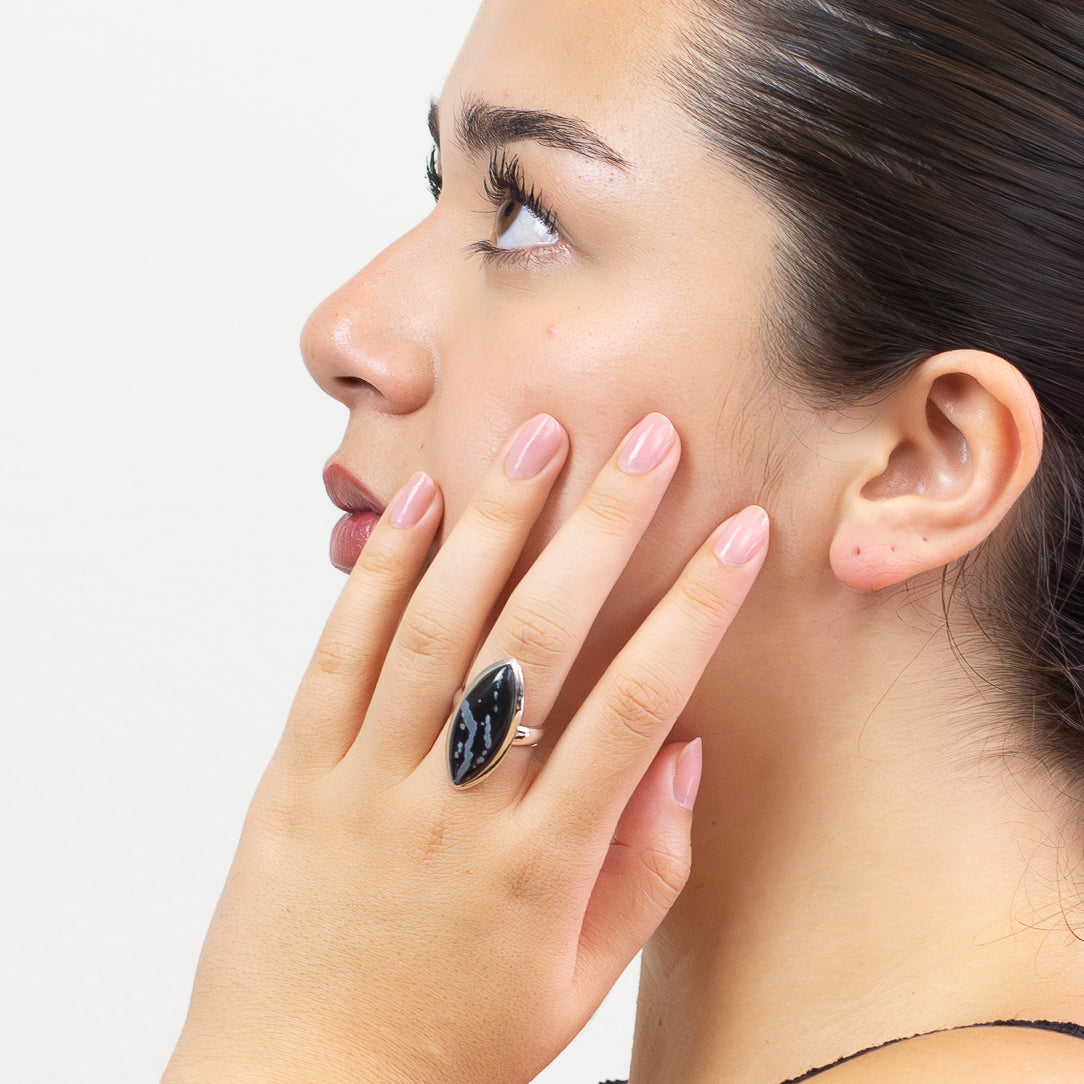Marquise snowflake obsidian cabochon ring set in sterling silver with black and white stone ON MODEL. MADE IN EARTH