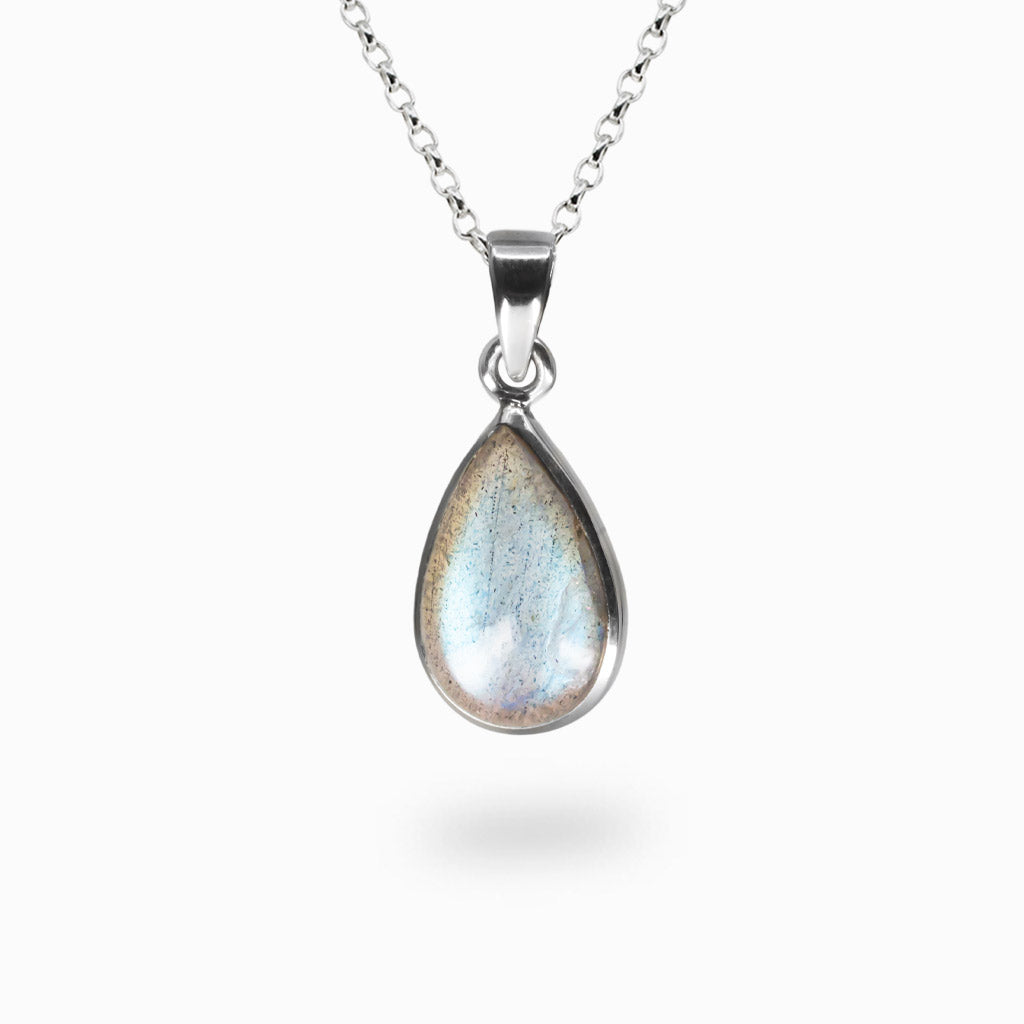Teardrop Labradorite pendant set in sterling silver on a chain, showing blue and green iridescence. | MADE IN EARTH