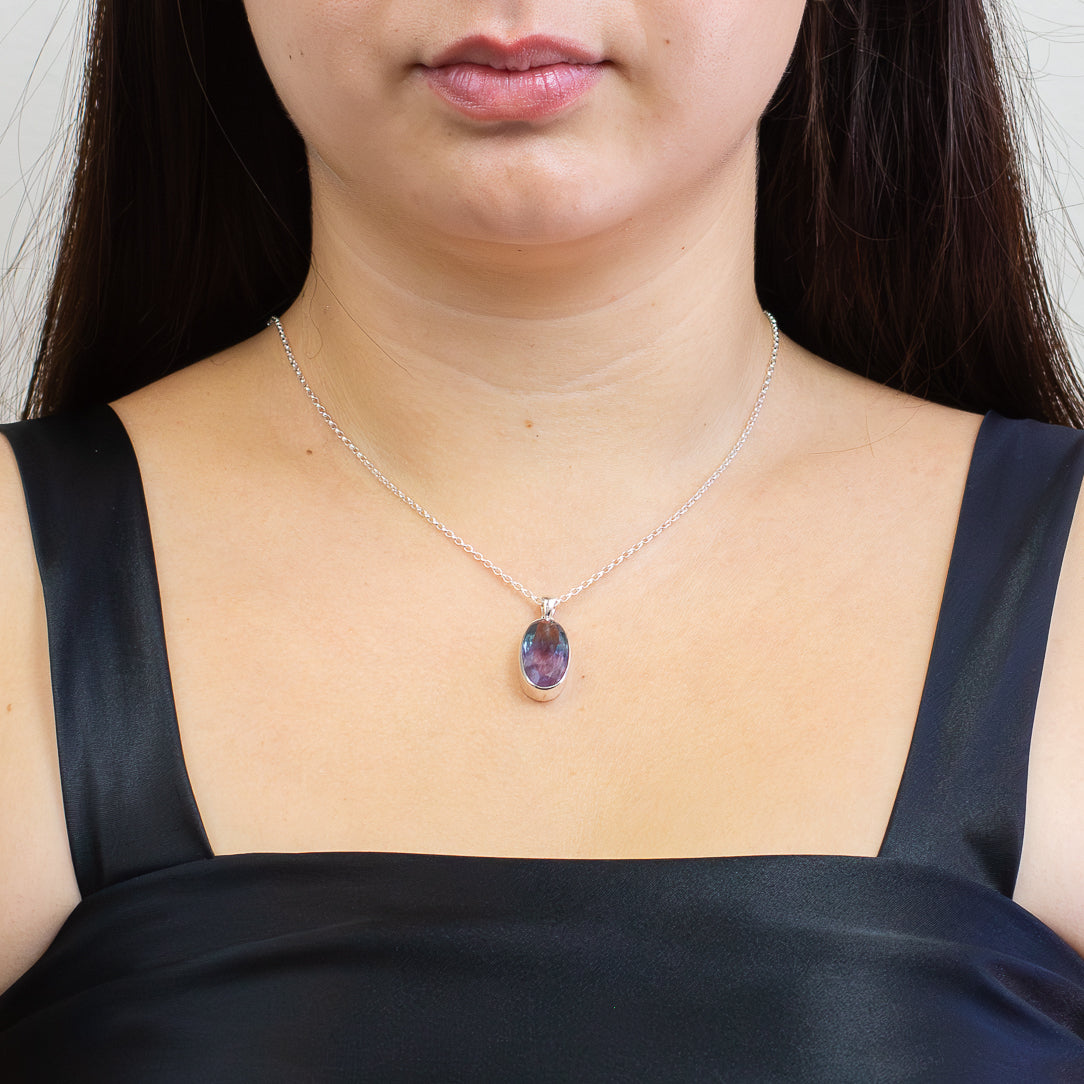 Faceted oval purple fluorite pendant set in sterling silver on a chain ON MODEL | MADE IN EARTH