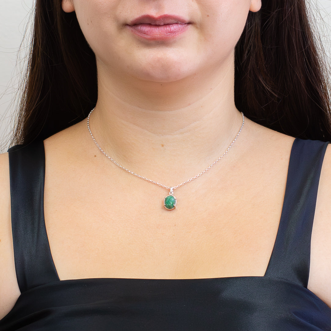 Cabochon emerald pendant in a sterling silver claw setting on a fine chain. | MADE IN EARTH
