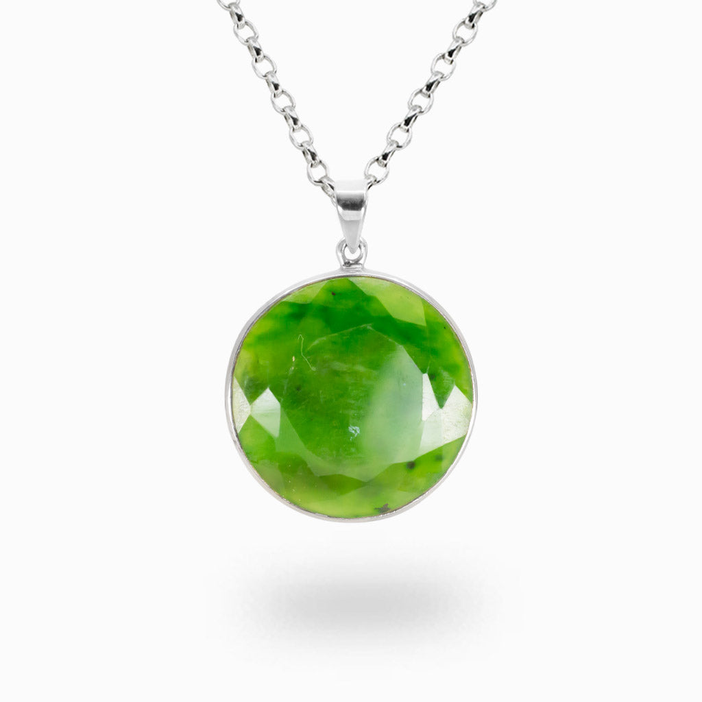 Faceted round Nephrite Jade pendant necklace in sterling silver featuring vibrant natural green coloration.