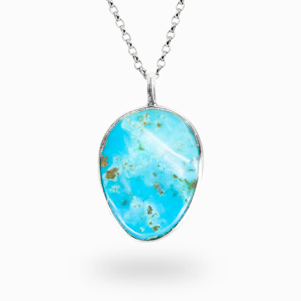 Turquoise pendant necklace on a white background