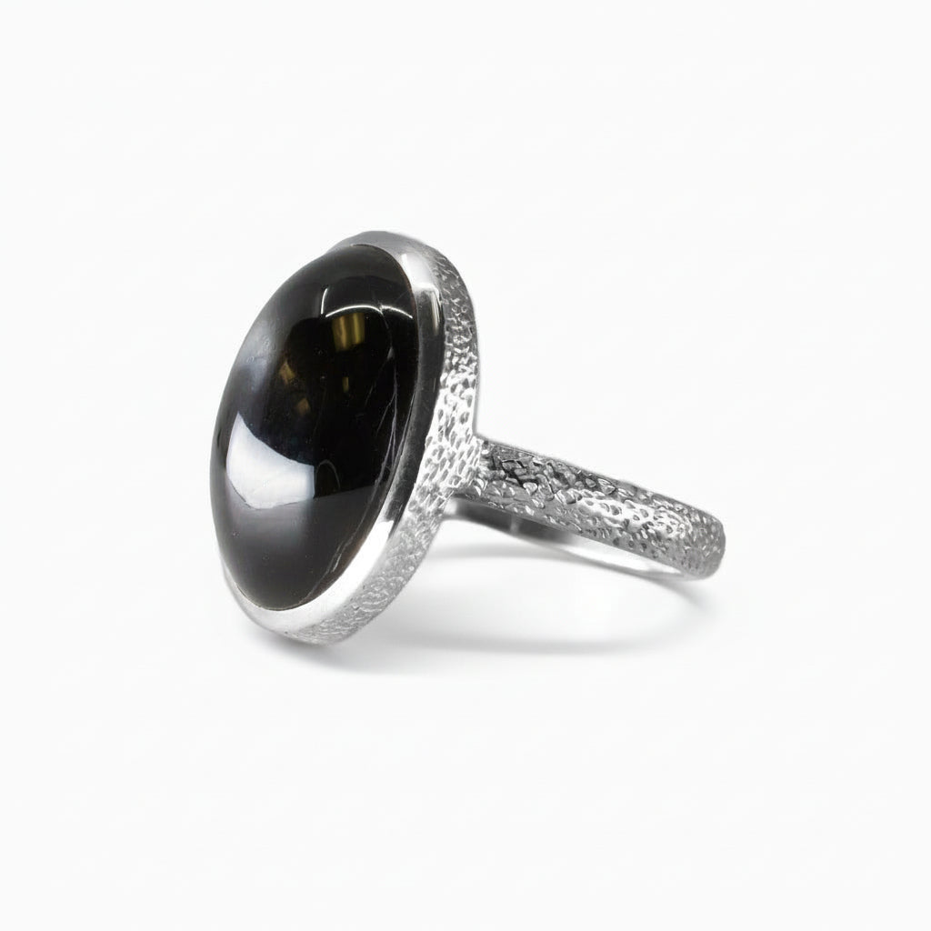 Oval Black Star cabochon ring in polished sterling silver with a subtly textured band | MADE IN EARTH