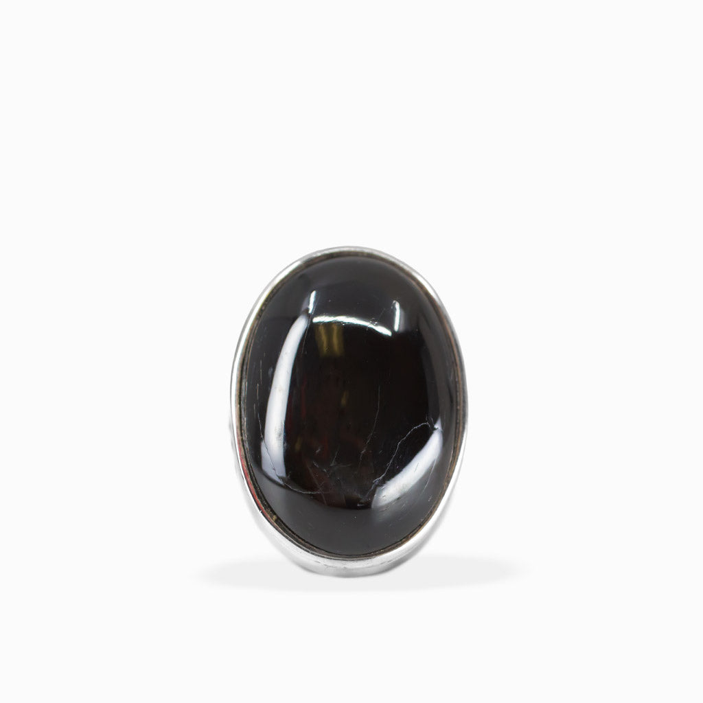 Oval Black Star Diopside ring with glossy black cabochon gemstone and polished 925 sterling silver bezel setting.