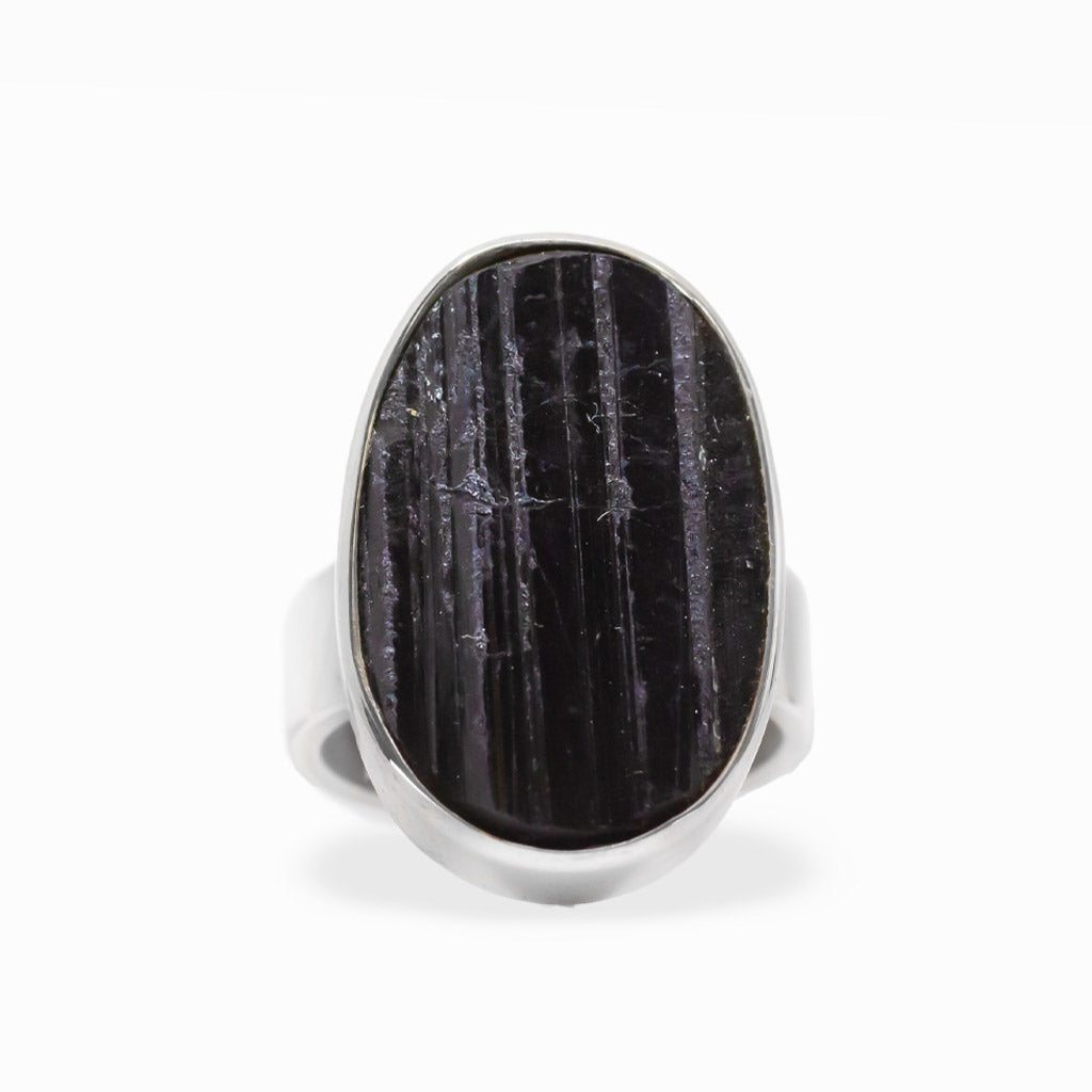 Large oval Black Tourmaline ring with natural vertical striations, polished sterling silver bezel setting, and wide band.
