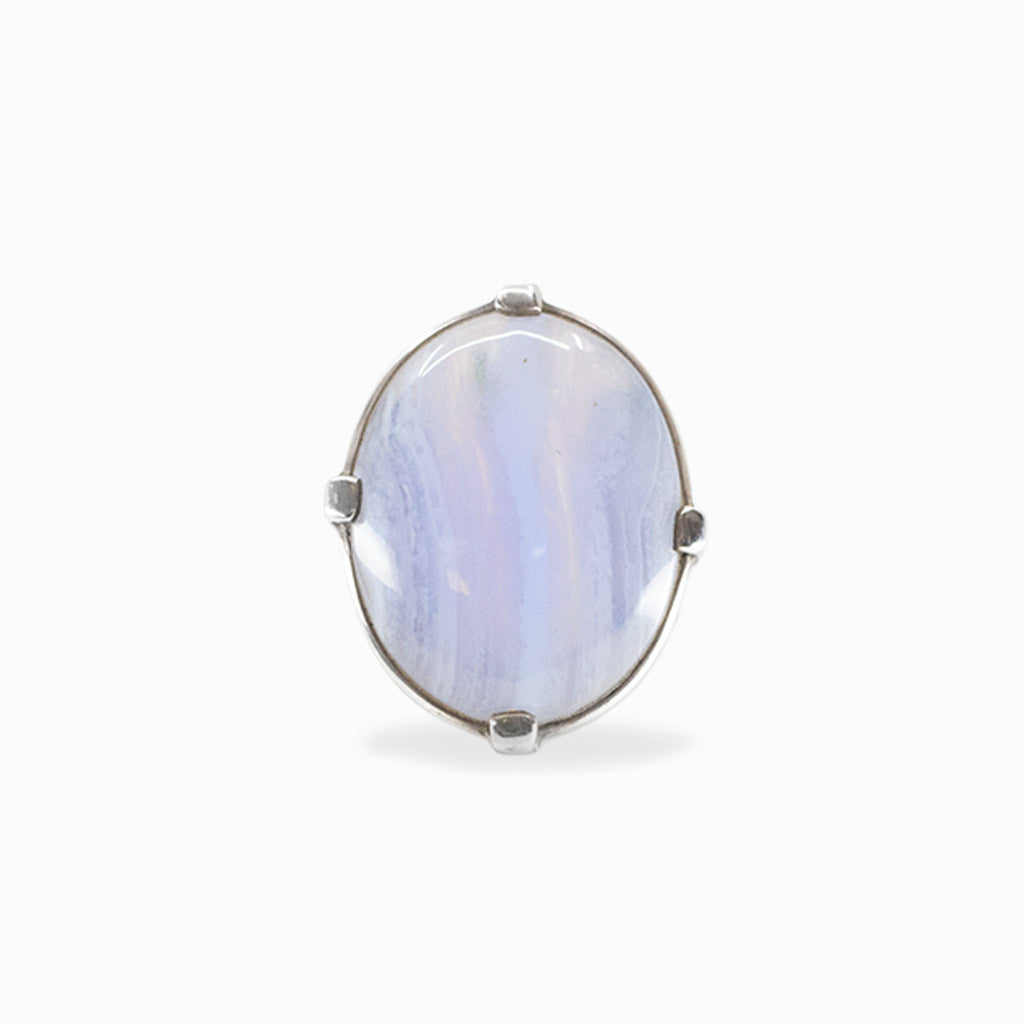 Oval pale blue Blue Lace Agate cabochon held by four prongs in a 925 sterling silver ring.