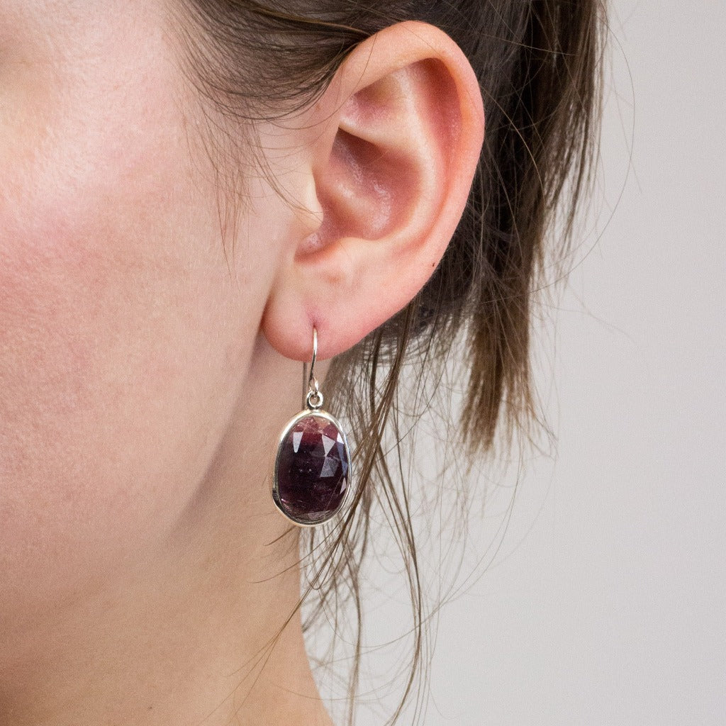 Sapphire drop earrings on model