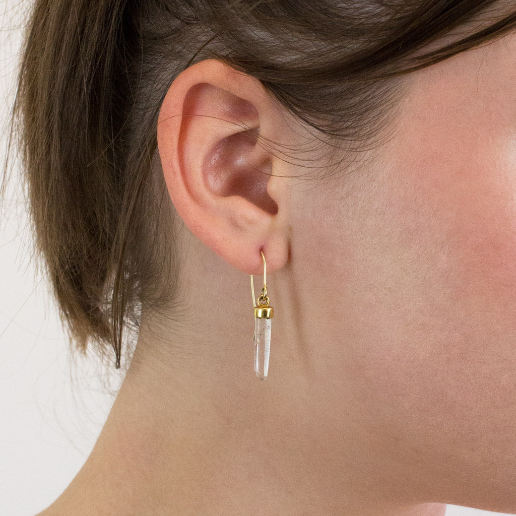 Laser Quartz drop earrings on model