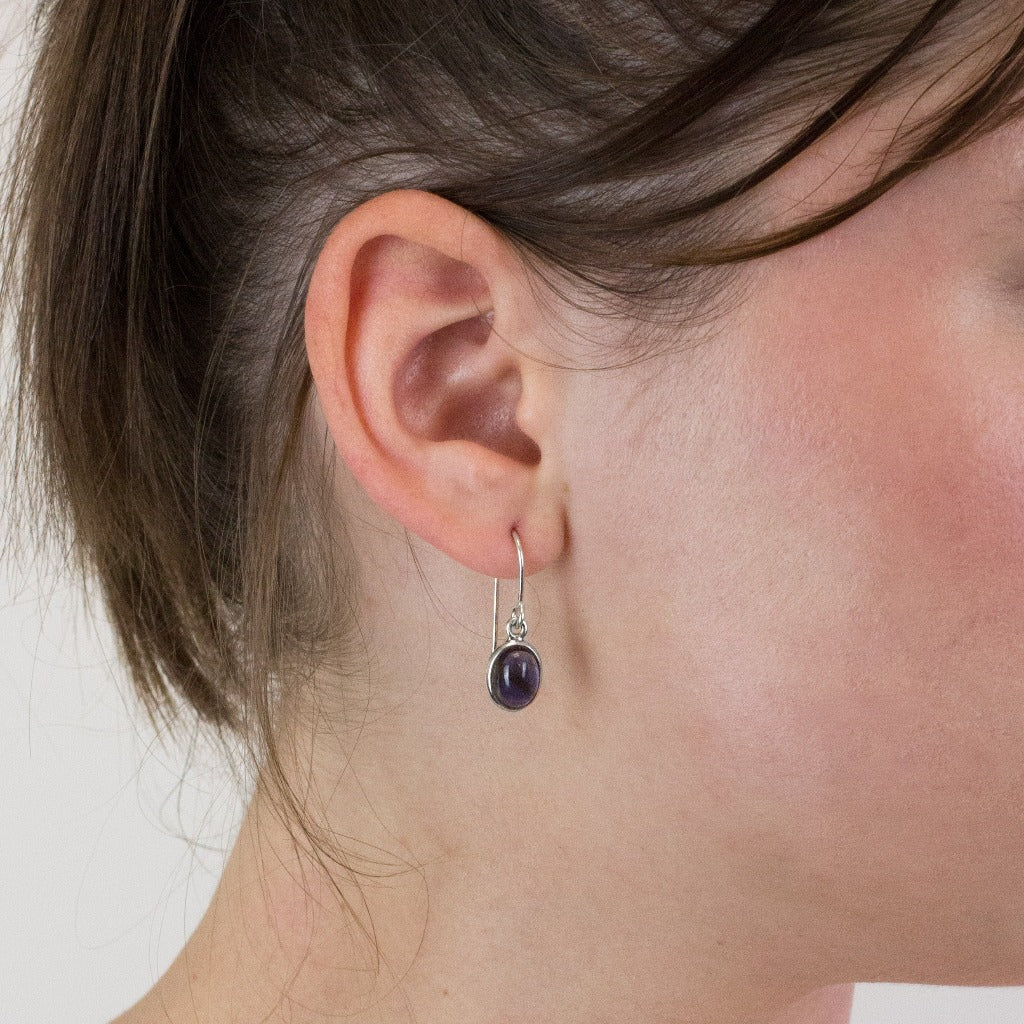 Iolite drop earrings on model