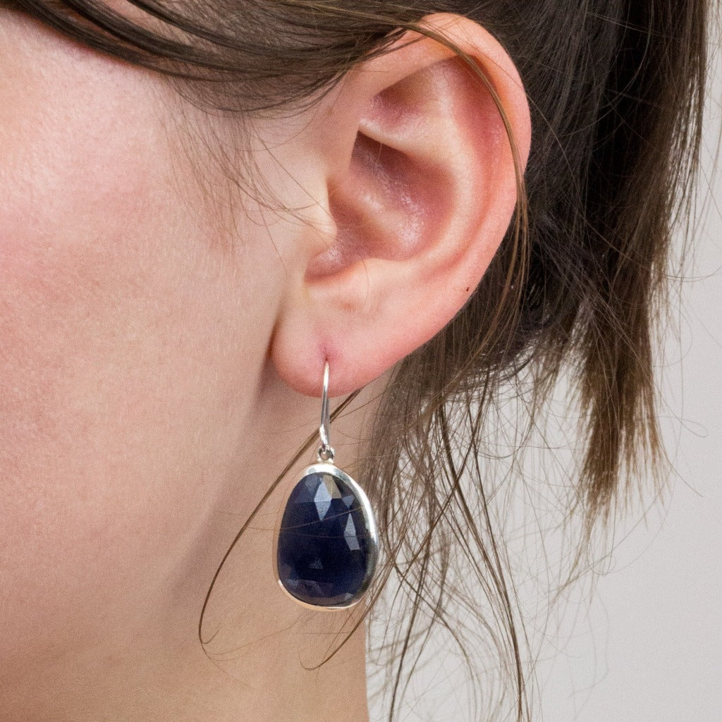 Sapphire drop earrings on model