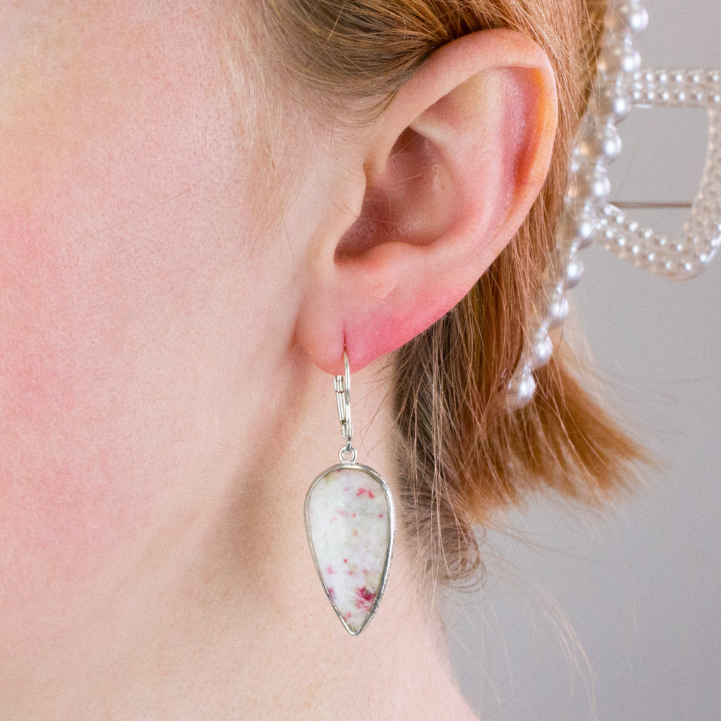 cinnebar drop earrings on model