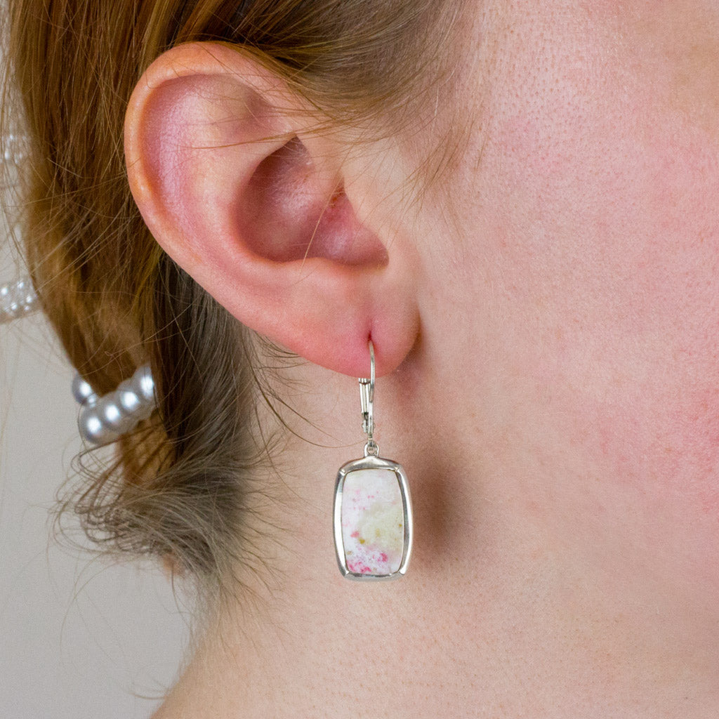 cinnerbar drop earrings on model