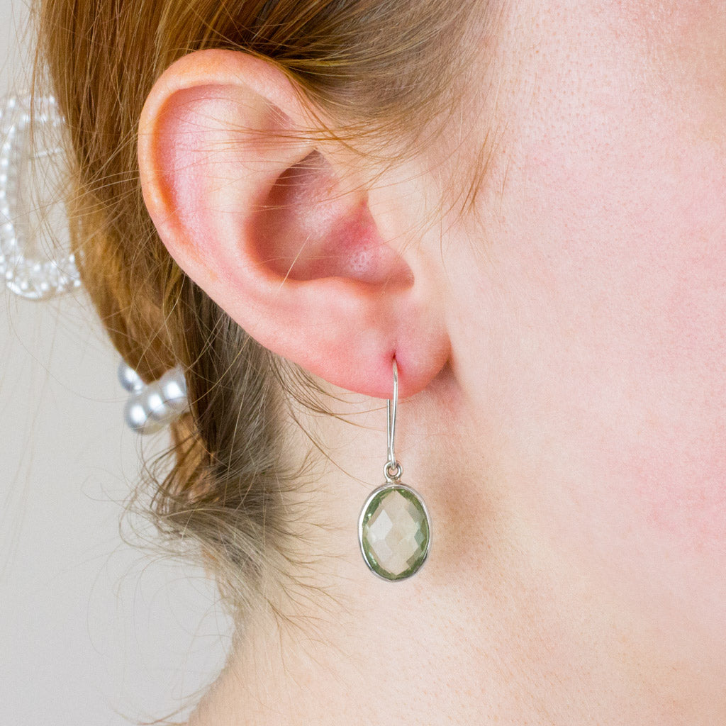 green quartz drop earrings on model