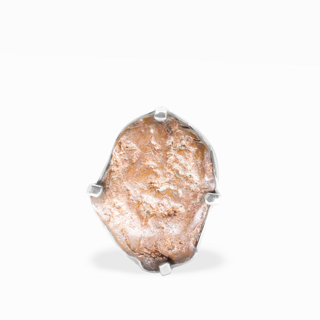 Freeform native Copper ring with warm rose-gold metallic tones, natural rough texture, and polished sterling silver prong setting.