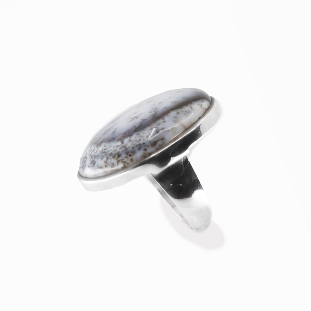 Dendritic Opal round cabochon ring in polished sterling silver with milky white tones and delicate natural branch-like dendritic inclusions.