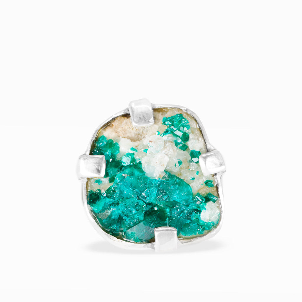Freeform Dioptase ring with vibrant emerald-green crystalline clusters, white mineral matrix, and polished sterling silver prong setting.