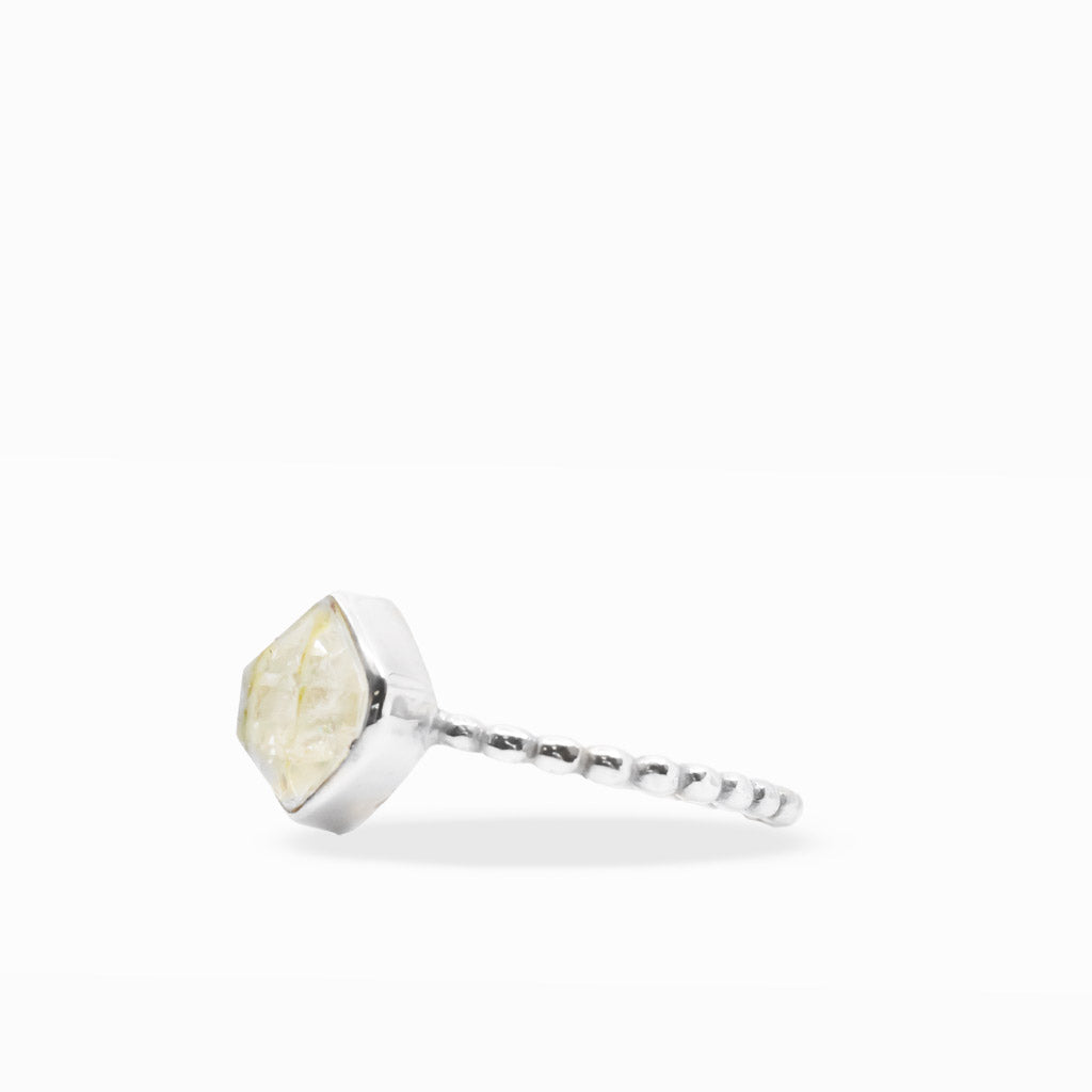 Clear diamond-shaped Herkimer Diamond Quartz ring with natural inclusions, sterling silver bezel setting, and textured beaded band.
