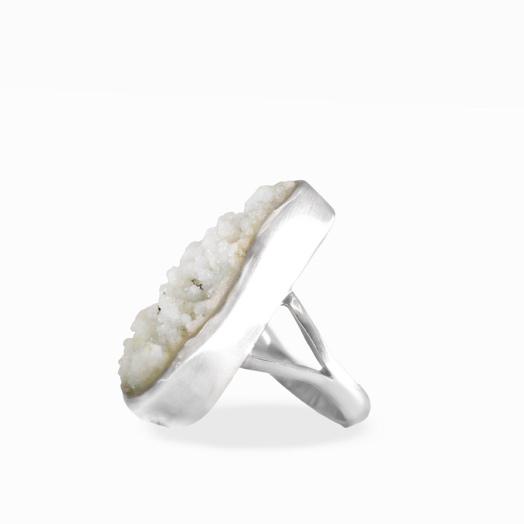 Freeform Hoar Frost ring with delicate white druzy crystal formations, polished sterling silver bezel setting, and split band.