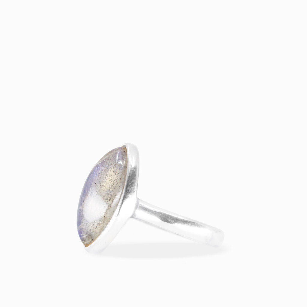 Marquise Labradorite ring with translucent gray gemstone, delicate blue flashes, natural inclusions, and polished sterling silver bezel setting.