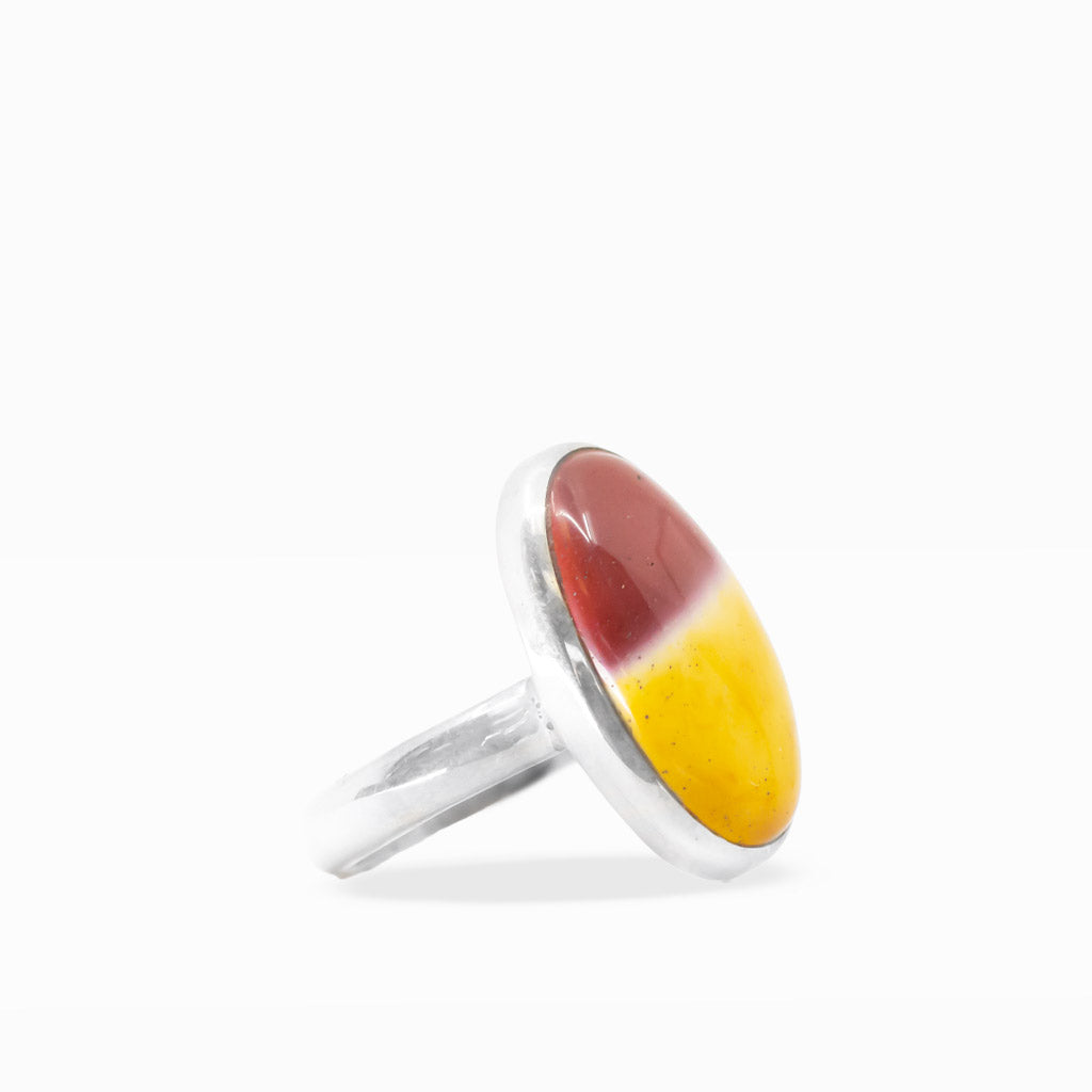 Oval Mookaite Jasper ring featuring vibrant golden yellow, burgundy, and cream color blocking in polished sterling silver bezel setting.