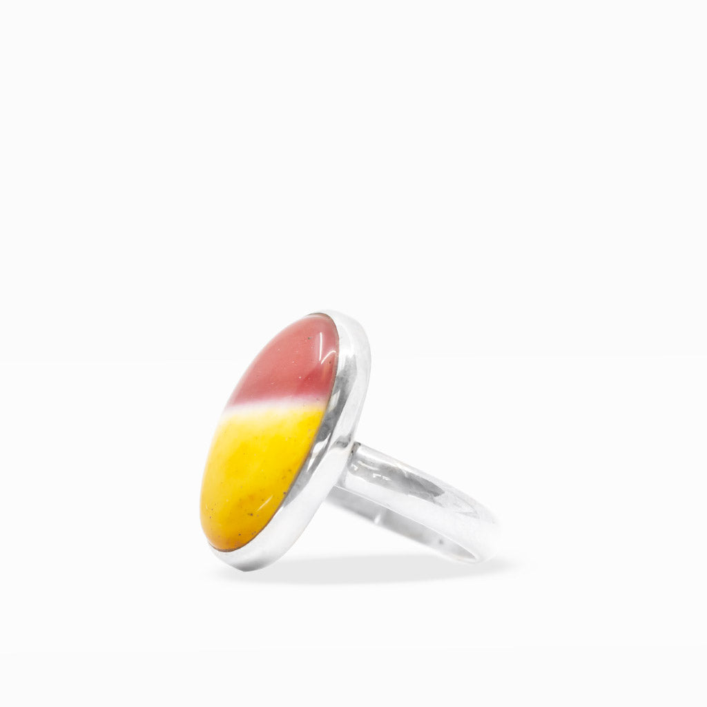 Oval Mookaite Jasper ring featuring vibrant golden yellow, burgundy, and cream color blocking in polished sterling silver bezel setting.