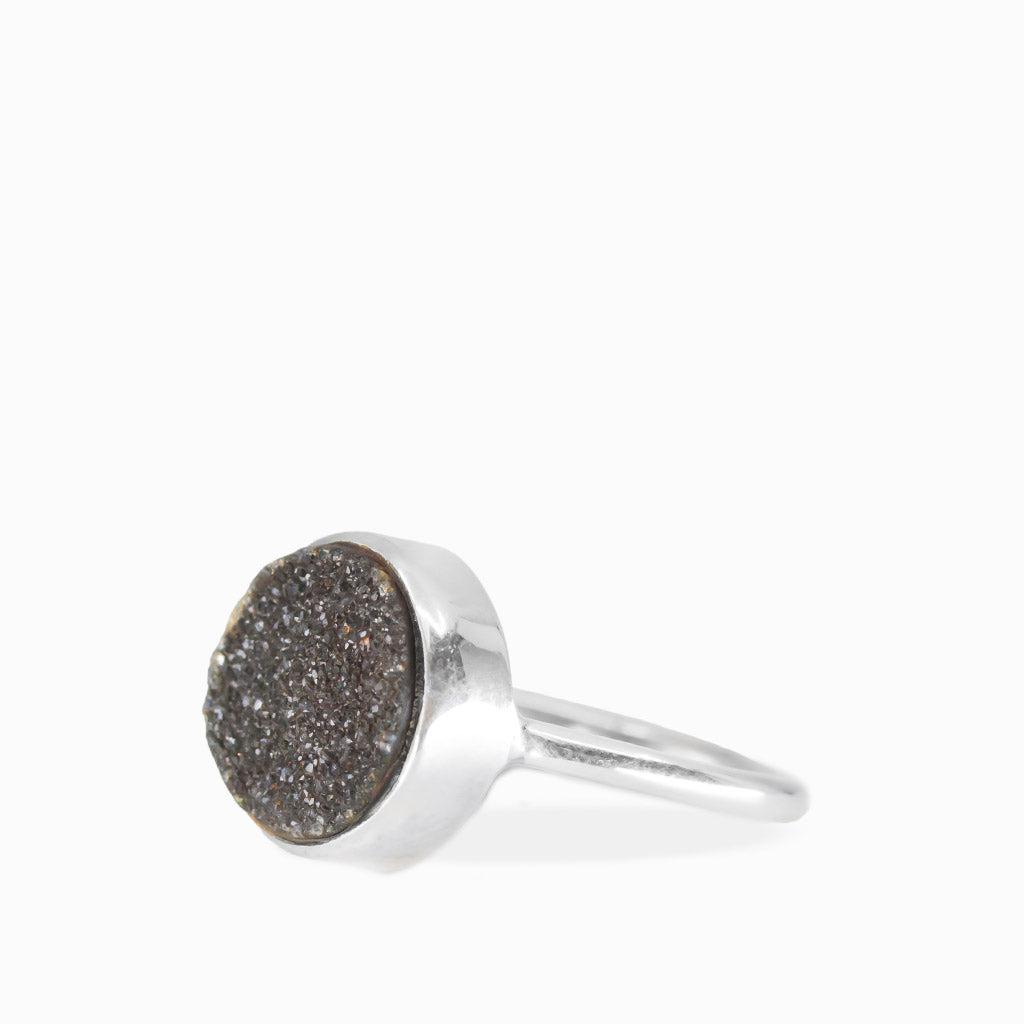 Round Black Onyx Druzy ring with sparkling dark crystalline surface, polished sterling silver bezel setting, and slim band.