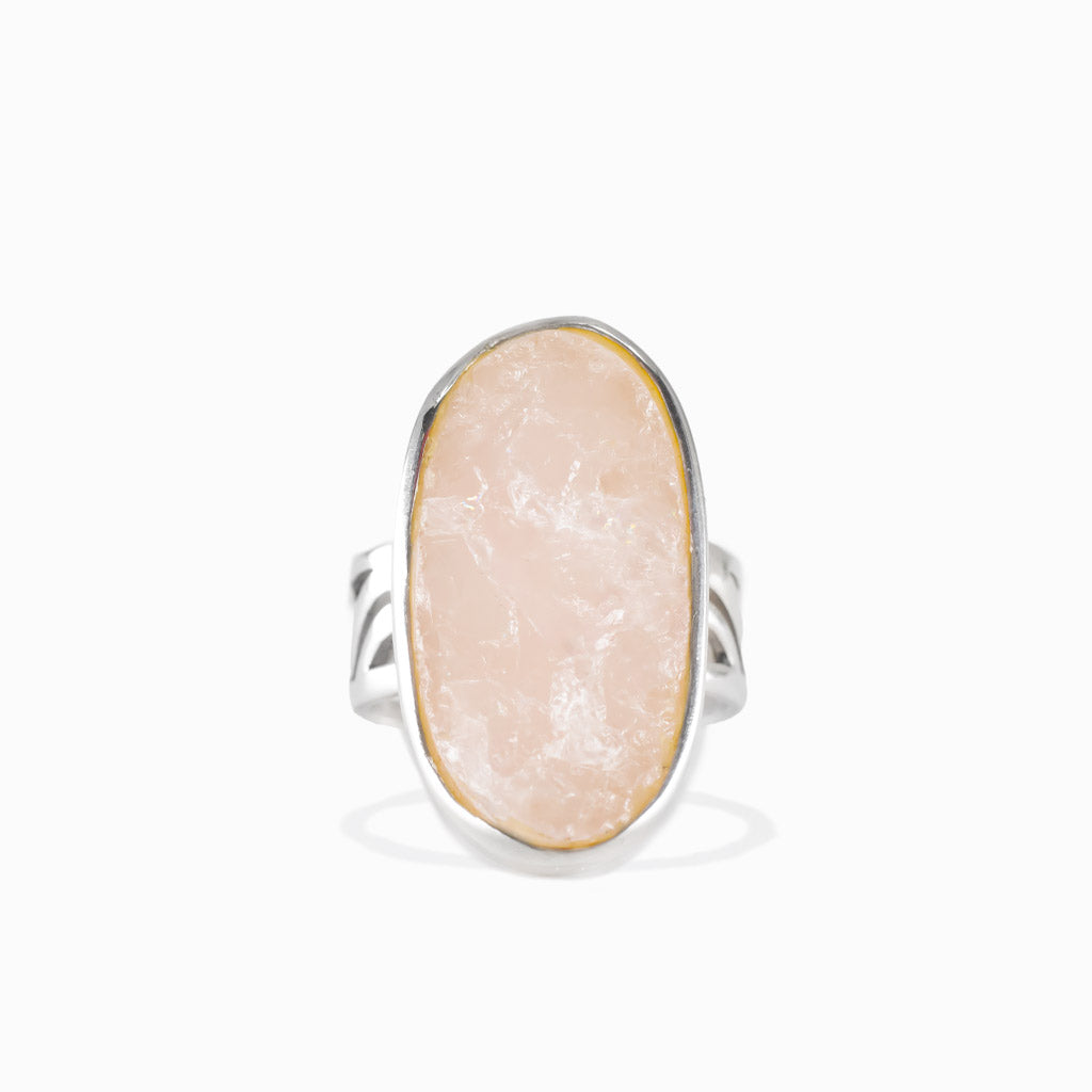 Oval raw rose quartz ring in sterling silver bezel setting