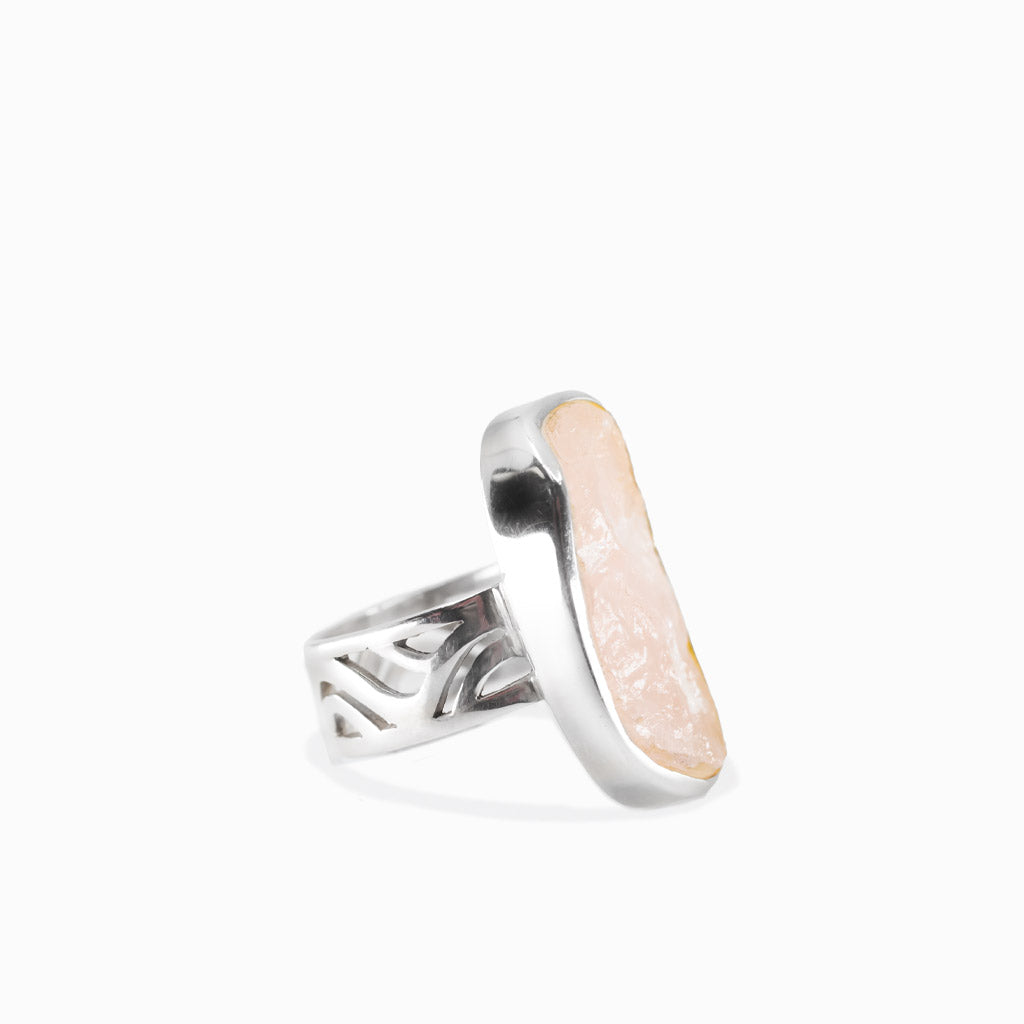 Oval raw rose quartz ring in sterling silver bezel setting