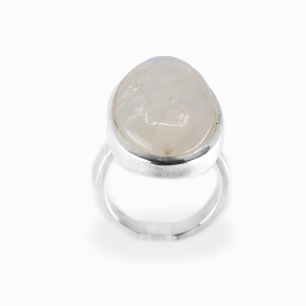Oval Rainbow Moonstone cabochon sterling silver statement ring with blue iridescence.