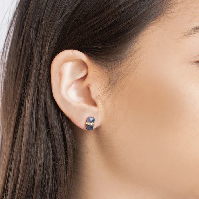 Raw blue Sapphire crystal stud earrings held in polished sterling silver settings.
