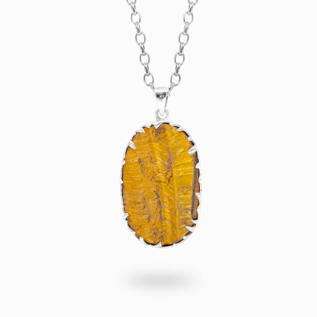 Raw oval golden-brown Tiger Eye pendant held in polished 925 sterling silver.

