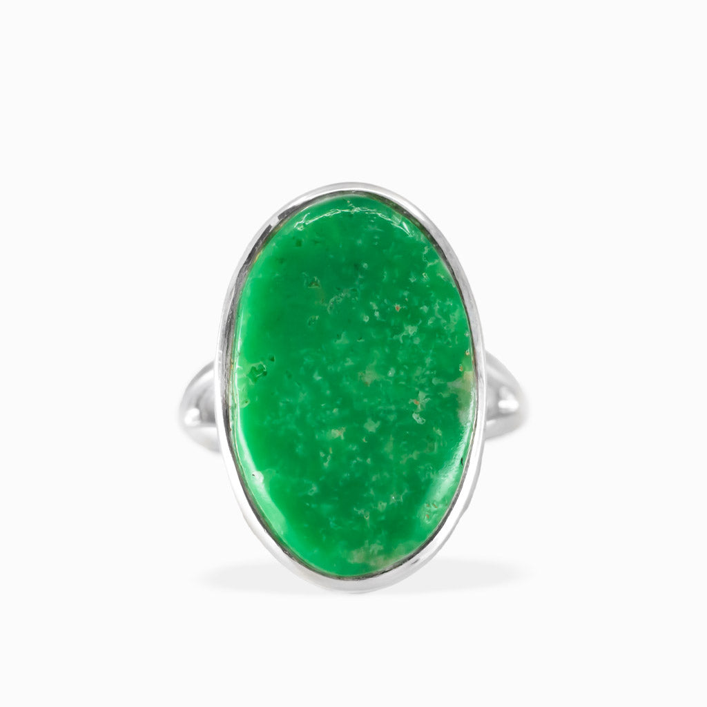 Oval Variscite ring with vivid emerald-green cabochon, subtle natural mottling, and polished sterling silver bezel setting.