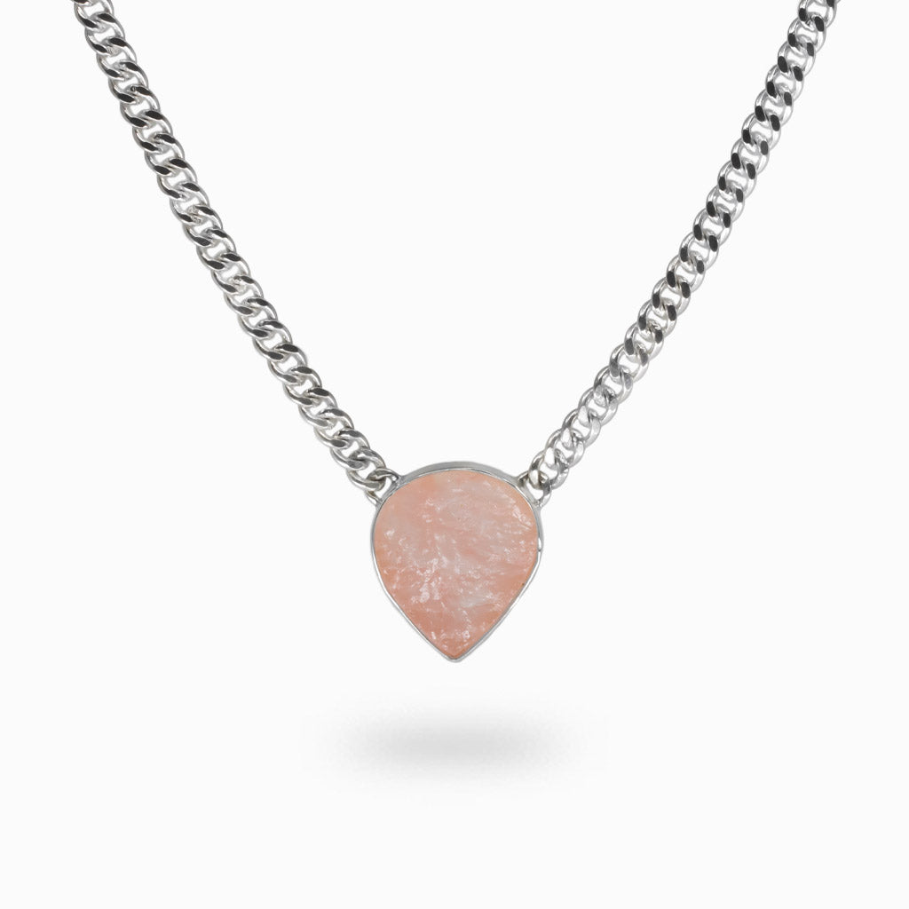 Raw teardrop rose quartz pendant with soft pink tones set in sterling silver with attached silver chain. | MADE IN EARTH