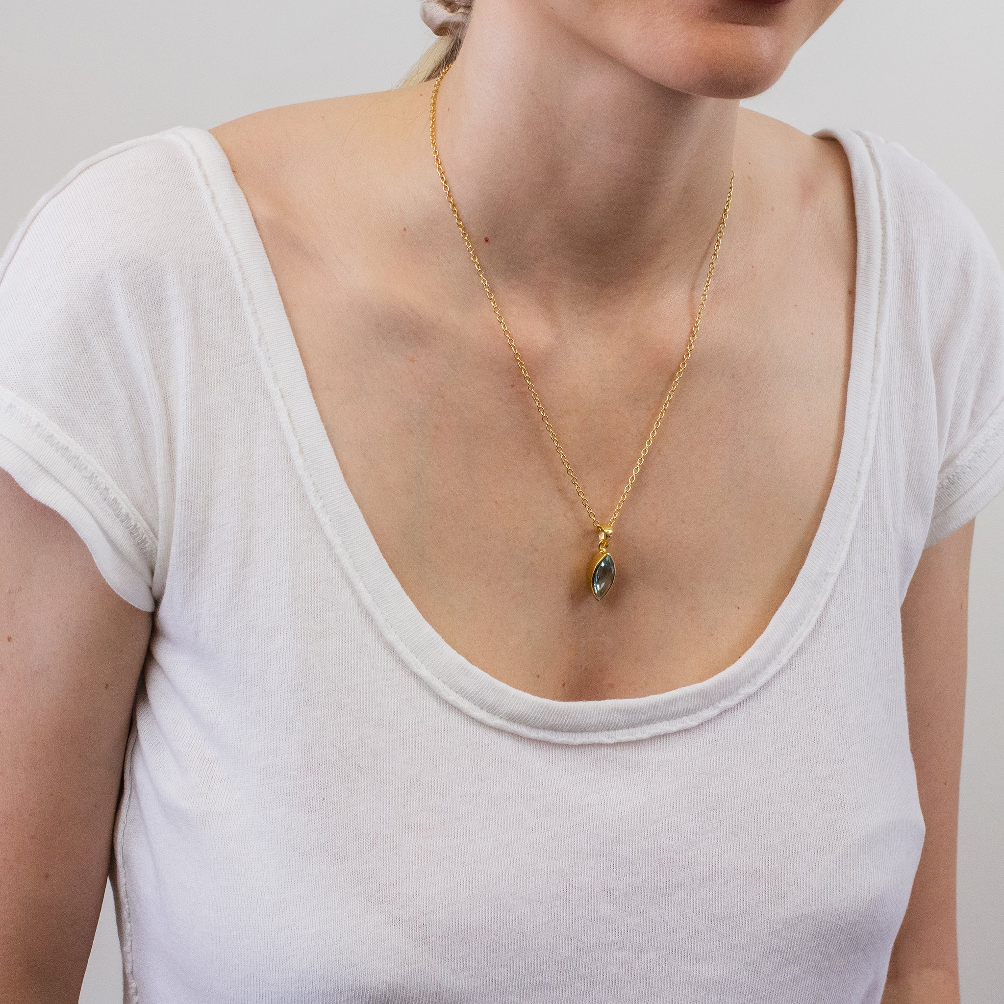 BLUE TOPAZ NECKLACE WITH GOLD VERMEIL FINISH ON MODEL