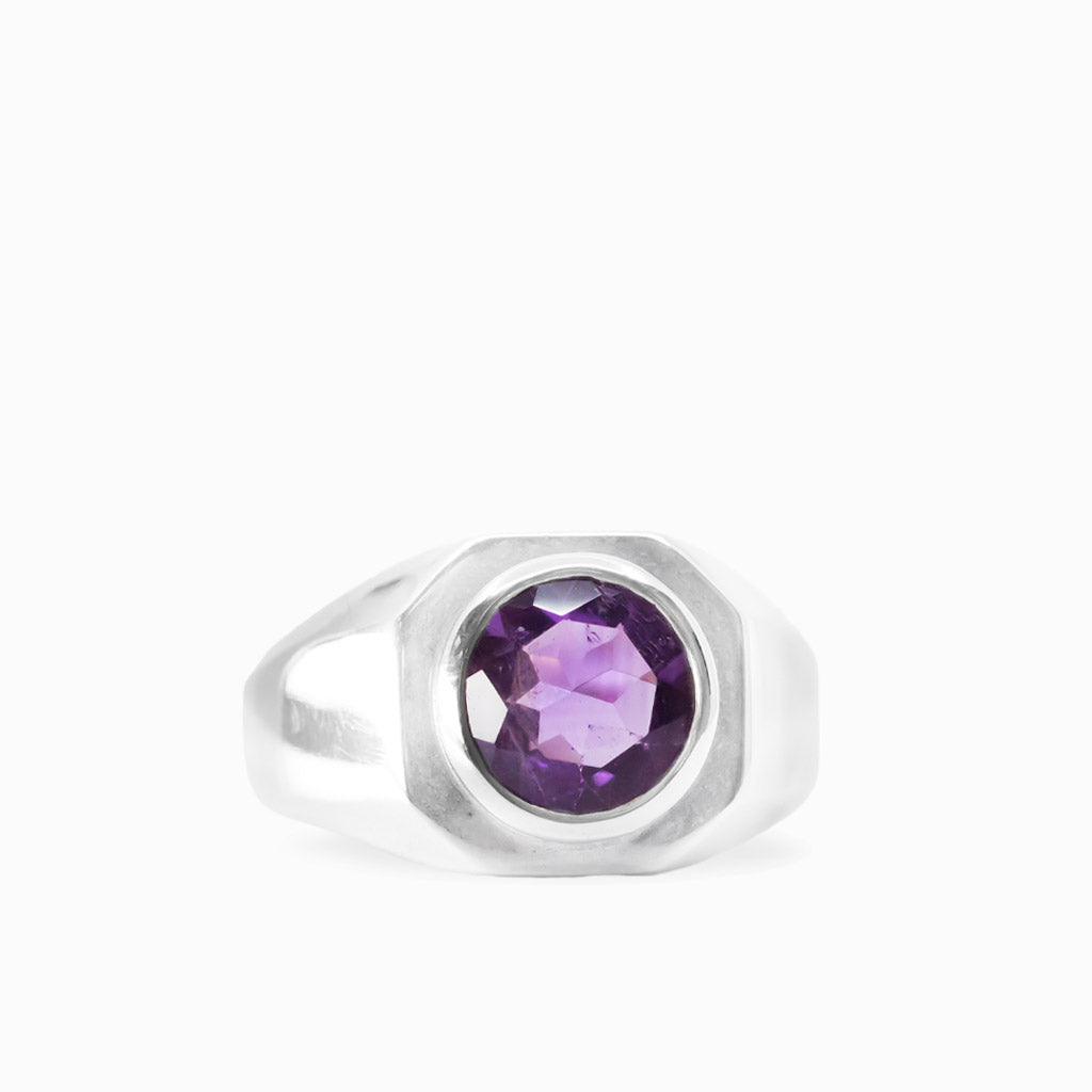 Round faceted purple Amethyst gemstone bezel set in a polished 925 sterling silver ring.
