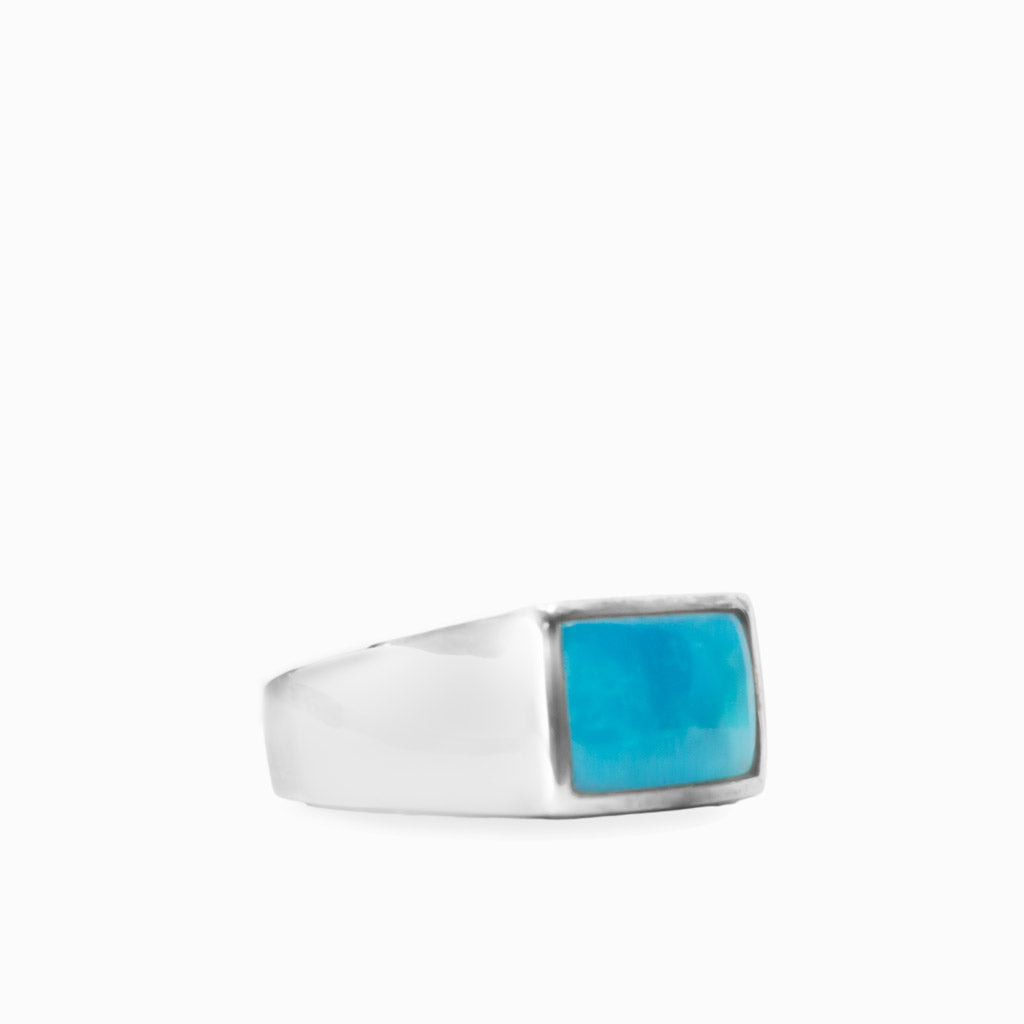 Rectangular vivid blue Sleeping Beauty Turquoise cabochon set in a polished 925 sterling silver ring.